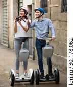 couple traveling by segways. Стоковое фото, фотограф Яков Филимонов / Фотобанк Лори