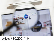 Cincinnati, Ohio, USA - 14 March 2019: Procter Gamble Company, PG official website homepage under magnifying glass. Concept Procter Gamble, care products, logo visible on smartphone, tablet screen. Редакционное фото, фотограф Сергей Тимофеев / Фотобанк Лори