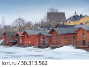 A view of old wooden barns in the Porvoo Old Town, Finland (2019 год). Редакционное фото, фотограф Ольга Визави / Фотобанк Лори