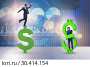 Businessman in dollar and debt concept. Стоковое фото, фотограф Elnur / Фотобанк Лори