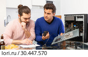 Men drink beer and repair the desktop computer. Стоковое фото, фотограф Яков Филимонов / Фотобанк Лори