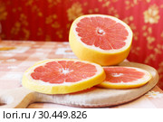Grapefruit red cut by pieces. Стоковое фото, фотограф Александр Птах / Фотобанк Лори