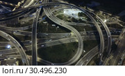 Aerial view of lighted highway road junctions at night. Стоковое видео, видеограф Яков Филимонов / Фотобанк Лори
