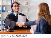 Young woman visiting male lawyer. Стоковое фото, фотограф Elnur / Фотобанк Лори