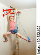 Little beautiful girl is playing at the gymnasium in the children's room. Стоковое фото, фотограф Акиньшин Владимир / Фотобанк Лори