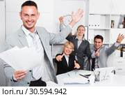 Excited businessman with happy team celebrating victory. Стоковое фото, фотограф Яков Филимонов / Фотобанк Лори