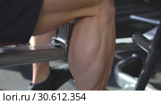 Male Bodybuilder Doing Heavy Weight Exercise For Legs. Стоковое видео, видеограф Виктор Аллин / Фотобанк Лори