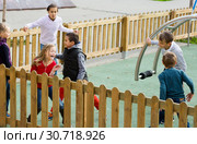 Positive kids running around while playing. Стоковое фото, фотограф Яков Филимонов / Фотобанк Лори
