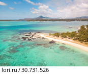 Aerial view of beautiful tropical beach with turquoise sea. Tropical vacation paradise destination of D'eau Douce and Ile aux Cerfs Mauritius. Стоковое фото, фотограф Matej Kastelic / Фотобанк Лори