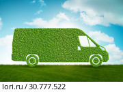 Green low emission electic vehicle concept - 3d rendering. Стоковое фото, фотограф Elnur / Фотобанк Лори