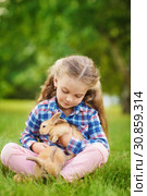 Girl with a cute little rabbit, outdoor, summer day. Стоковое фото, фотограф Чирцова Наталья / Фотобанк Лори