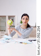 Young woman in budget planning concept. Стоковое фото, фотограф Elnur / Фотобанк Лори