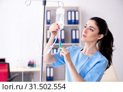 Young female doctor in infusion concept. Стоковое фото, фотограф Elnur / Фотобанк Лори