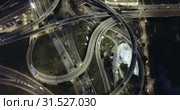 Aerial view of lighted highway road junctions at night. Стоковое видео, видеограф Яков Филимонов / Фотобанк Лори