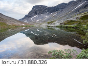 Calm surface of mountain lake with reflection, Khibins mountains in Kola Peninsula, Russia. Стоковое фото, фотограф Кекяляйнен Андрей / Фотобанк Лори