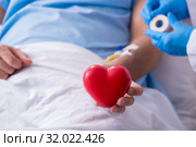 Male patient getting blood transfusion in hospital clinic. Стоковое фото, фотограф Elnur / Фотобанк Лори