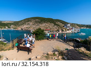 Sevastopol, Crimea - July 3. 2019. People on the observation deck in Balaklava Bay. Редакционное фото, фотограф Володина Ольга / Фотобанк Лори