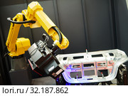 Robotic industry. Robot with 3D sensor scanner measures surface of detail in automotive industry. Стоковое фото, фотограф Дмитрий Калиновский / Фотобанк Лори