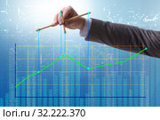 Businessman controlling the market with strings. Стоковое фото, фотограф Elnur / Фотобанк Лори