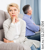 sorry middle-aged couple quarreling at home with each other. Стоковое фото, фотограф Яков Филимонов / Фотобанк Лори