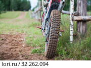 Off road recreational motorcycle standing on rural track, rear view at cross country tyre. Стоковое фото, фотограф Кекяляйнен Андрей / Фотобанк Лори