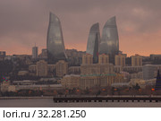 Пламенные башни в городском пейзаже на фоне облачного январского заката (2018 год). Стоковое фото, фотограф Виктор Карасев / Фотобанк Лори