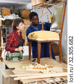 Restorers working with vintage armchair. Стоковое фото, фотограф Яков Филимонов / Фотобанк Лори