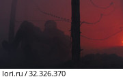 19-10-2019 RUSSIA, REPUBLIC OF TATARSTAN: Soldier crawling under the wire iron trying escape from the fire. Редакционное видео, видеограф Константин Шишкин / Фотобанк Лори