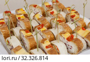 Snack rolls with bread on a platter. Стоковое фото, фотограф Дмитрий Тищенко / Фотобанк Лори