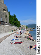 Herceg Novi, Montenegro - June 10. 2019. A People relax on the central city beach. Редакционное фото, фотограф Володина Ольга / Фотобанк Лори