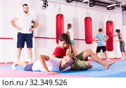 Kids practicing in pair self-protection. Стоковое фото, фотограф Яков Филимонов / Фотобанк Лори
