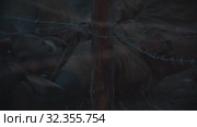 19-10-2019 RUSSIA, REPUBLIC OF TATARSTAN: Wounded soldier crawl on the ground in the forest under the iron wire. Редакционное видео, видеограф Константин Шишкин / Фотобанк Лори