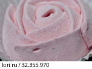 Aerial pink cherry marshmallows. In the form of a rose. Sprinkled with dextrose. Close-up. Стоковое фото, фотограф Vadzim Yakubovich / Фотобанк Лори