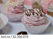 Aerial pink cherry marshmallows. Different shapes and sizes. Sprinkled with dextrose. Garnished with Chocolate. Стоковое фото, фотограф Vadzim Yakubovich / Фотобанк Лори