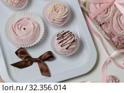 Aerial pink cherry marshmallows. Different shapes and sizes. Sprinkled with dextrose. Garnished with Chocolate. Стоковое фото, фотограф Vadzim Yakubovich / Фотобанк Лори