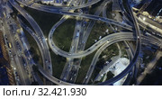 Aerial view of lighted highway road junctions at night. Стоковое видео, видеограф Яков Филимонов / Фотобанк Лори