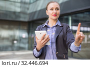 Employee woman with tablet touching finger on air. Стоковое фото, фотограф Яков Филимонов / Фотобанк Лори