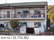 Low-rise apartment buildings are on outskirt streets of town. Modern small and tight houses for people living. Houses are built extremely close to railway (2013 год). Редакционное фото, фотограф Кекяляйнен Андрей / Фотобанк Лори