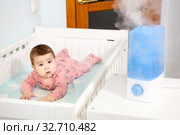 Air humidifier at bedroom. Ultrasonic device for comfortable living conditions, moisture increase in the apartment. Стоковое фото, фотограф Кекяляйнен Андрей / Фотобанк Лори
