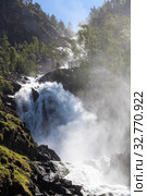 Latefoss or Latefossen consists of two separate streams flowing down. It is located on Norwegian National Road 13, Odda, Hordaland county, Norway (2018 год). Стоковое фото, фотограф Кекяляйнен Андрей / Фотобанк Лори