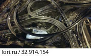 Aerial view of lighted highway road junctions at night. Стоковое видео, видеограф Яков Филимонов / Фотобанк Лори
