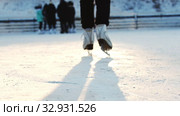 A woman on ice rink skating away from the camera. Стоковое видео, видеограф Константин Шишкин / Фотобанк Лори