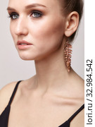 Beautiful woman with galvanic earring in form of leaf. Стоковое фото, фотограф Сергей Пристяжнюк (Serg Zastavkin) / Фотобанк Лори