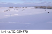 Рыбаки на льду. Соревнования по рыбалке с мормышкой со льда. Fishermans on the ice. Competitions in fishing with jig from ice. Стоковое видео, видеограф Евгений Романов / Фотобанк Лори
