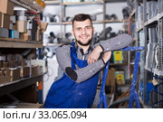 Male worker displaying his workplace. Стоковое фото, фотограф Яков Филимонов / Фотобанк Лори