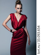 Fashion model in contemporary dress. Studio shot. Стоковое фото, фотограф Iryna Hramavataya / PantherMedia / Фотобанк Лори