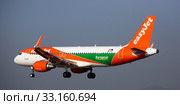 Barcelona, El Prat - January 24, 2020: Airline EasyJet plane comes in for a landing in an aeroport El Prat city of Barcelona. Board number OE-IVT. Редакционное фото, фотограф Яков Филимонов / Фотобанк Лори