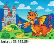 Happy orange dragon near castle. Стоковое фото, фотограф Klara Viskova / PantherMedia / Фотобанк Лори