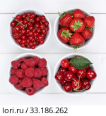 Red berries fruits in bowl with strawberries,raspberries and cherries. Стоковое фото, фотограф Markus Mainka / PantherMedia / Фотобанк Лори