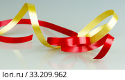 Gold and Red Ribbon String. Стоковое фото, фотограф Niklas Emmoth / PantherMedia / Фотобанк Лори